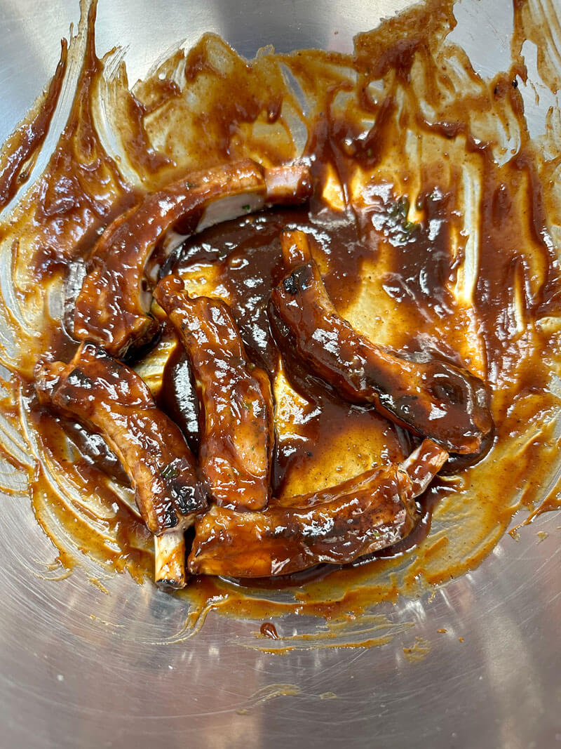 Toss ribs in bowl with bbq sauce