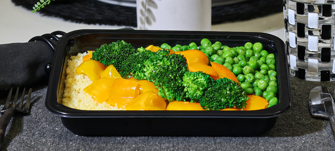 Healthy plant-based meals plated in a microwave safe meal prep container
